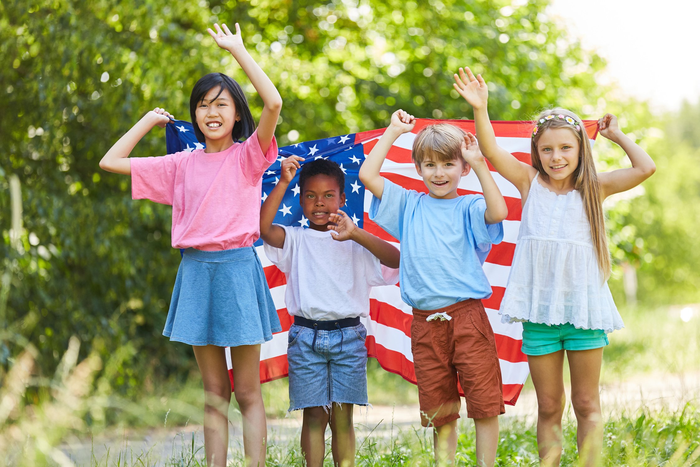 Group of Kids with the USA Flag Waving